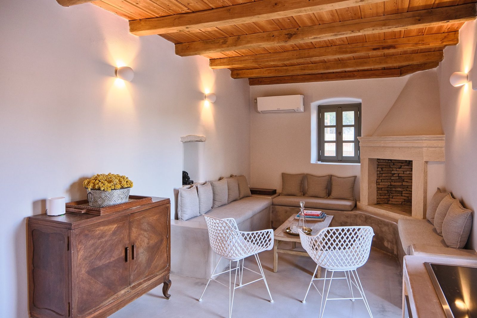 Living room with fireplace and built-in sofas